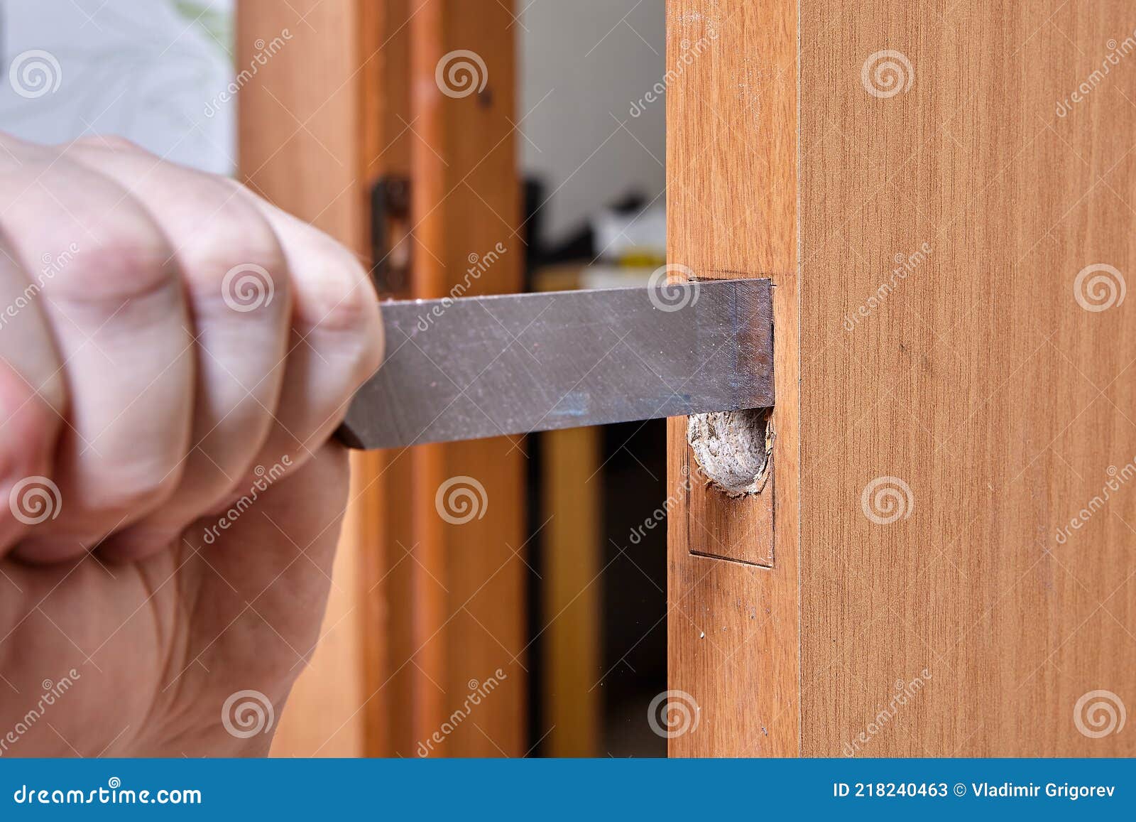 Using Chisel Joiner Cuts Hole for Door Latch Strip. Stock Image