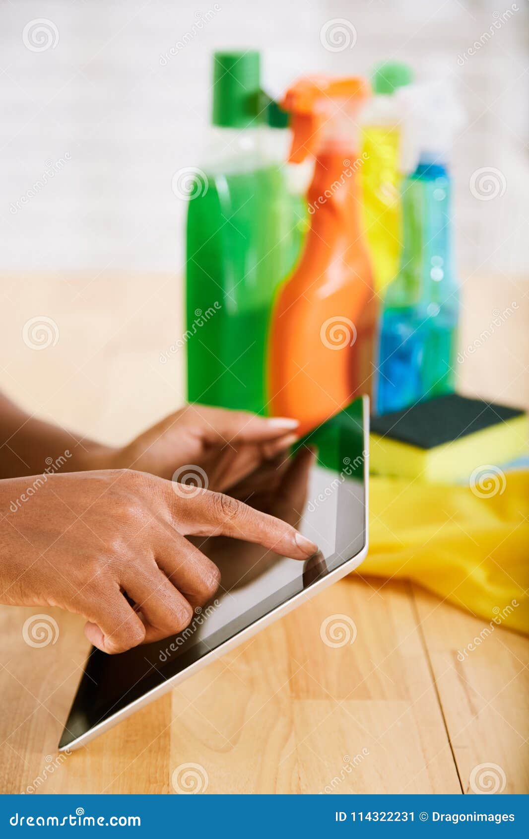 Using cleaning app stock image. Image of woman, female 114322231