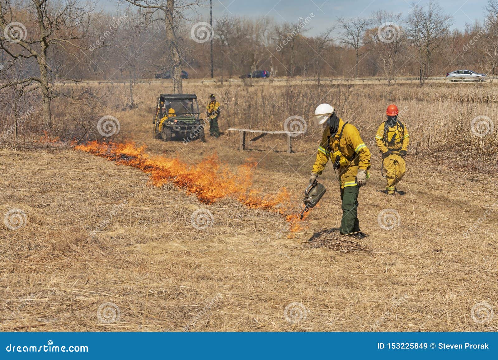 Using a Drip Torch To Start a Controlled Prairie Burn Stock Image