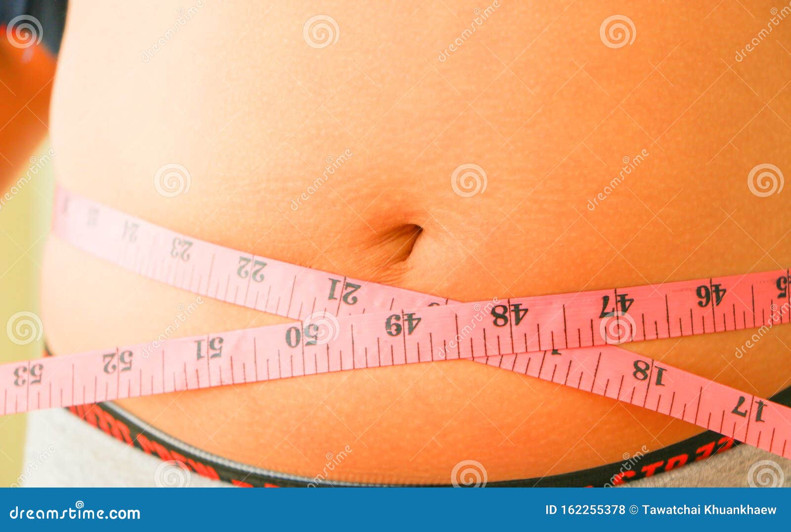 Using a tummy tape measure stock photo. Image of paunch 162255378