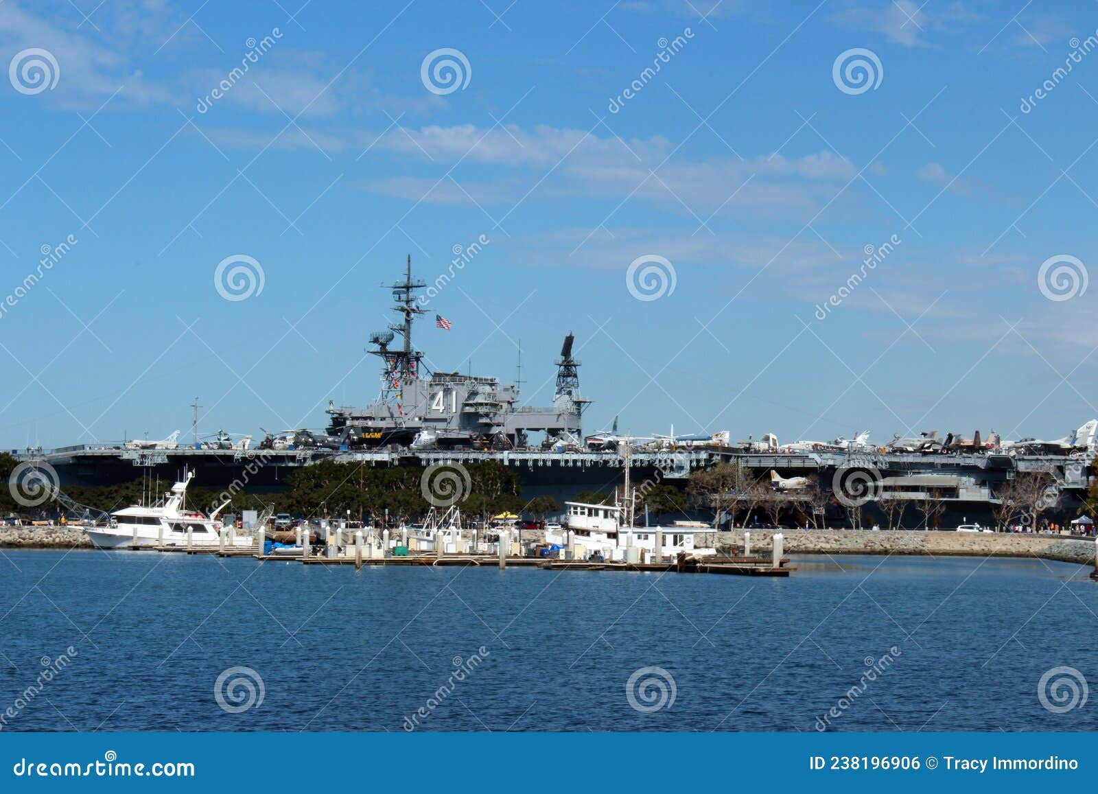 The USS Midway Aircraft Carrier and Fishing Boats at Navy Pier in