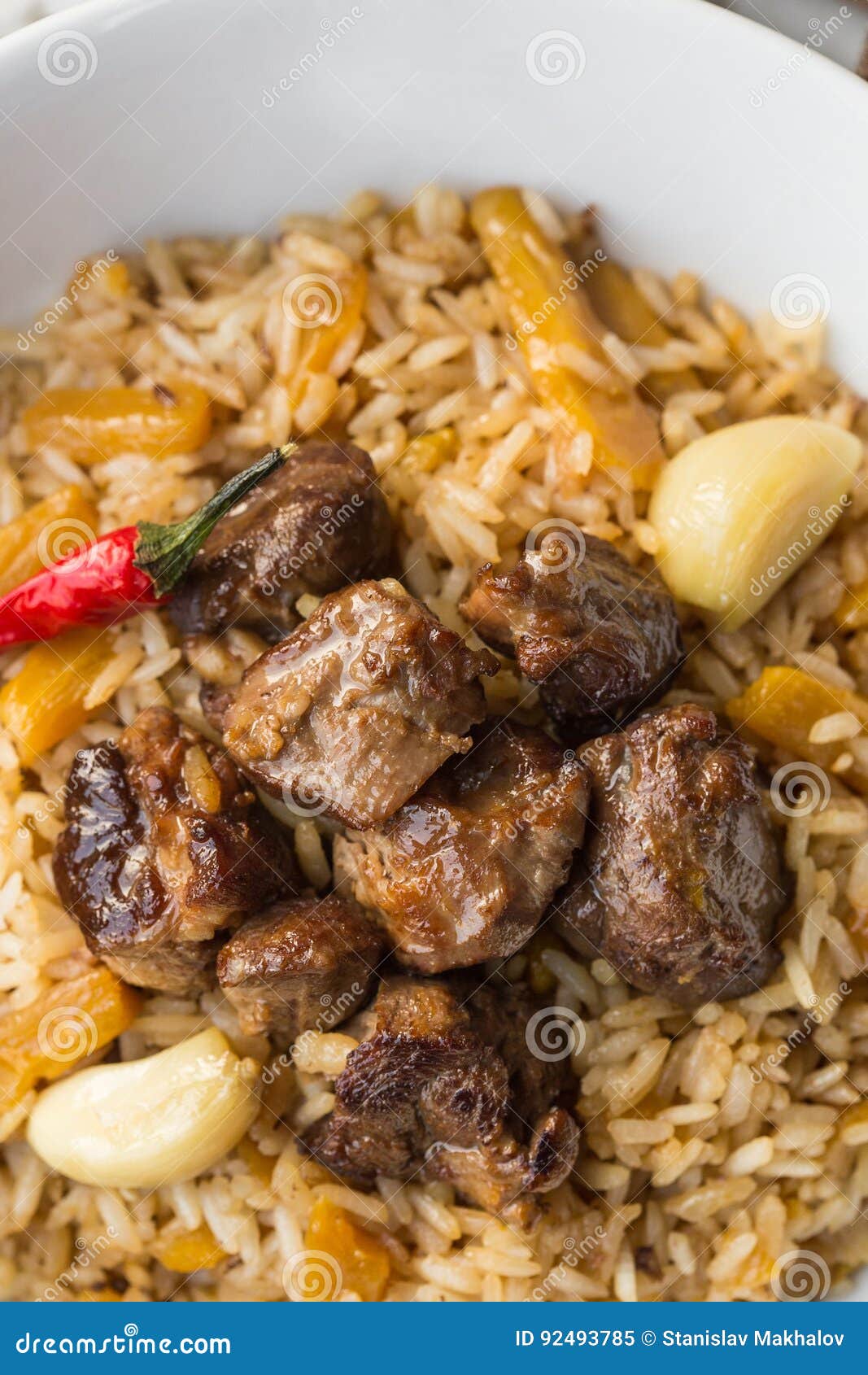 Uzbek Pilaf - Rice with Meat and Vegetables on the Table. Pilaf with ...