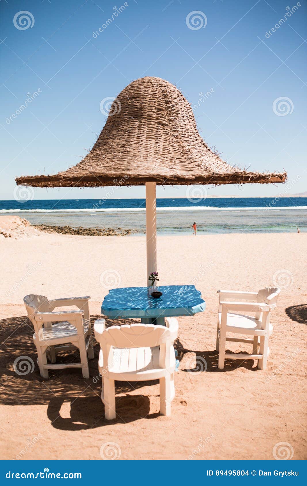 Vacation Holidays. Three Beach Lounge Chairs Under Tent on Beach. Stock