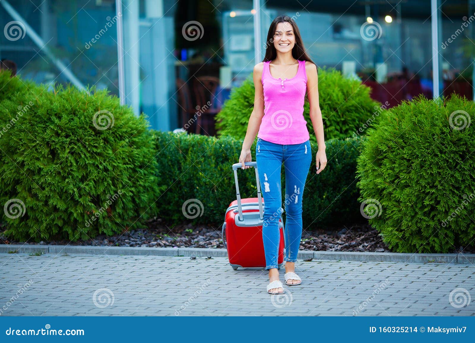 Vacation. Smiling Female Passenger Proceeding To Exit Gate Pulling