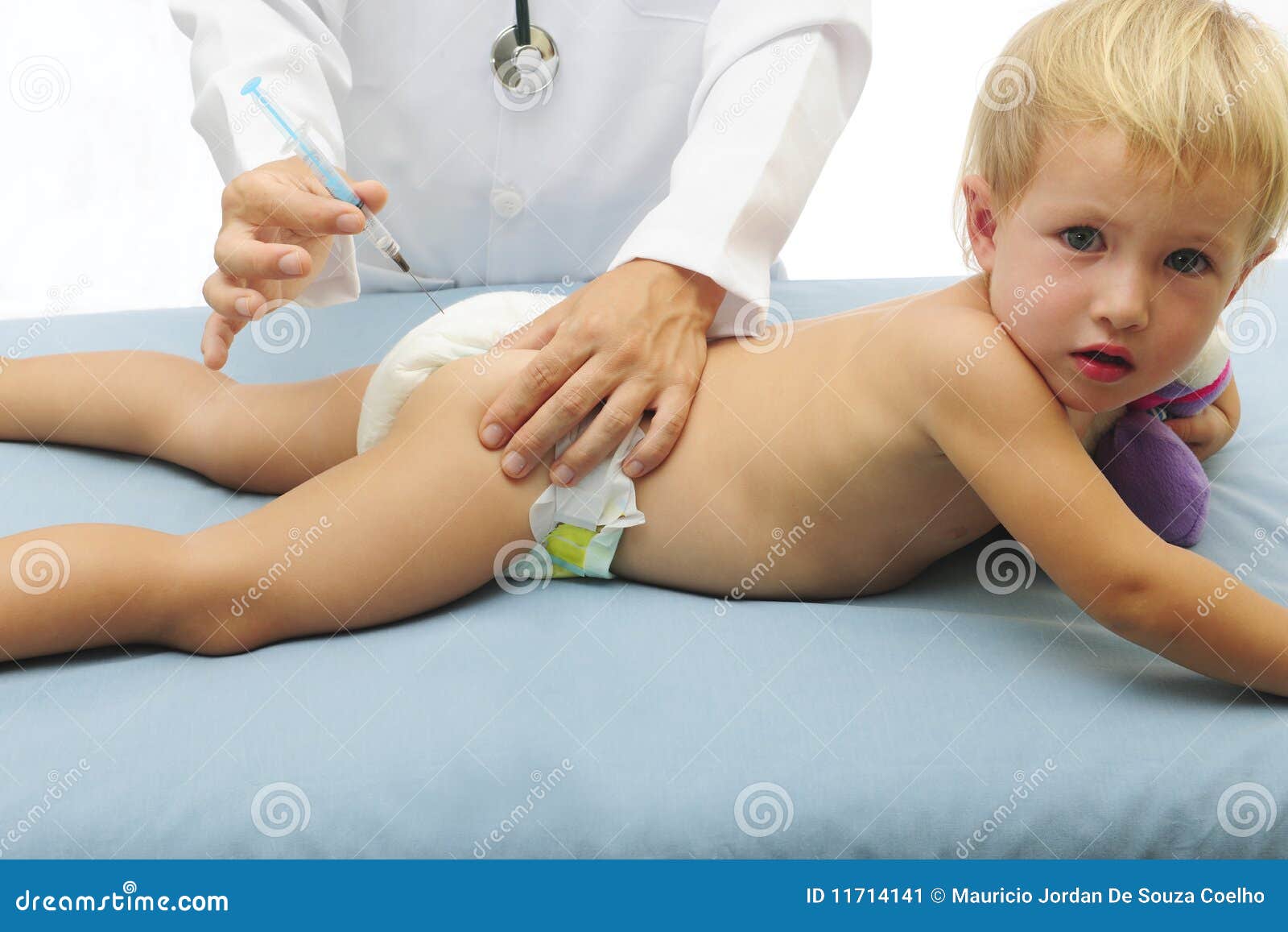 vaccination: doctor injecting baby