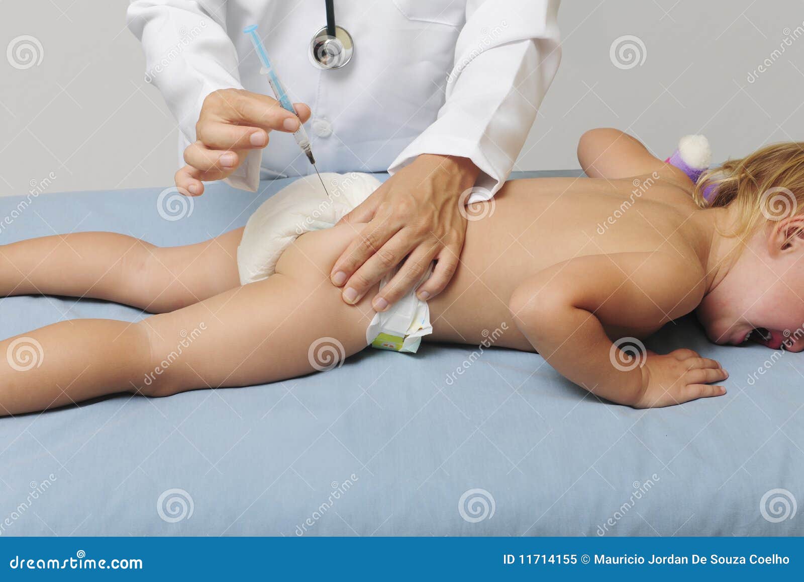 vaccination: doctor injecting baby