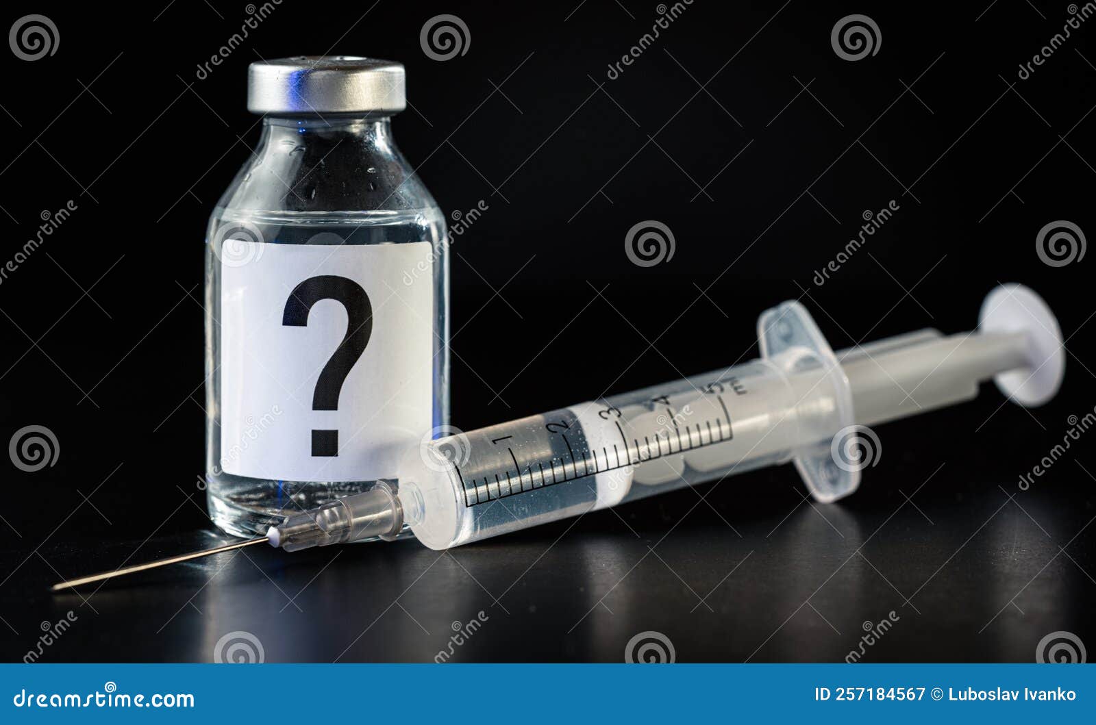 Vaccine Bottle with Hypodermic Syringe Needle Near, Question Mark on