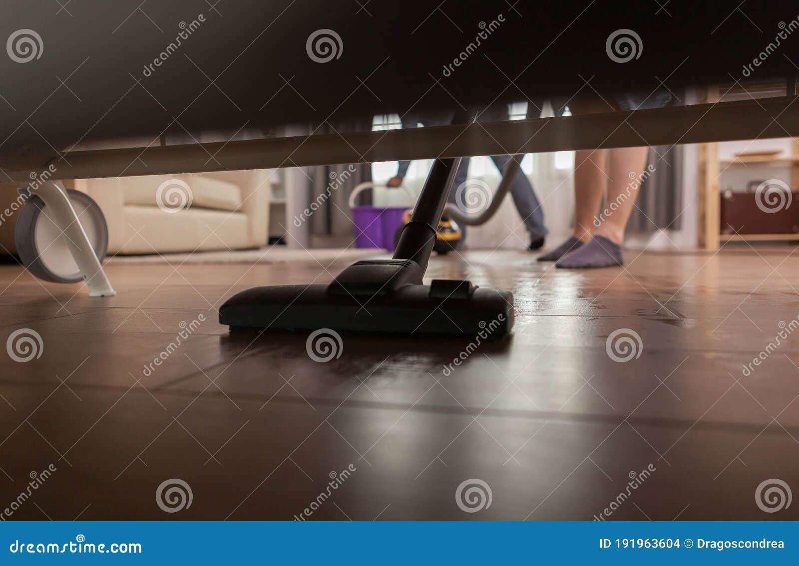 Vacum cleaner under sofa stock photo. Image of housework 191963604