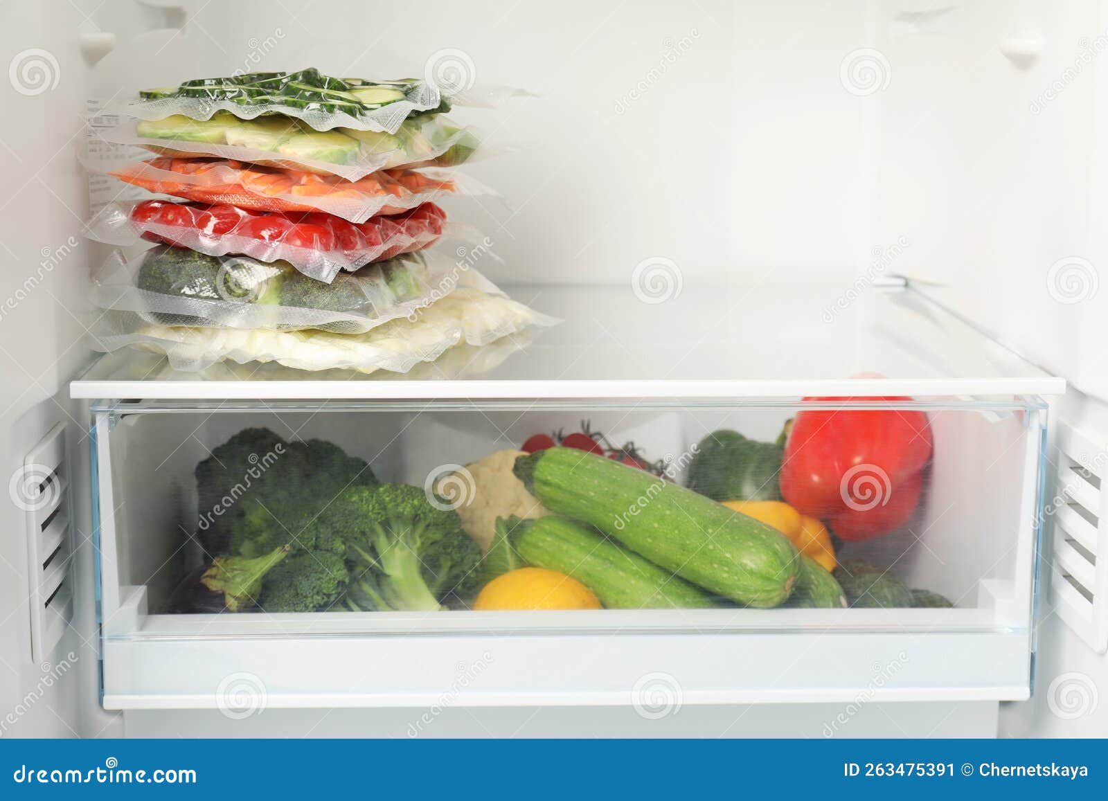 Vacuum Bags with Different Vegetables in Fridge, Space for Text. Food