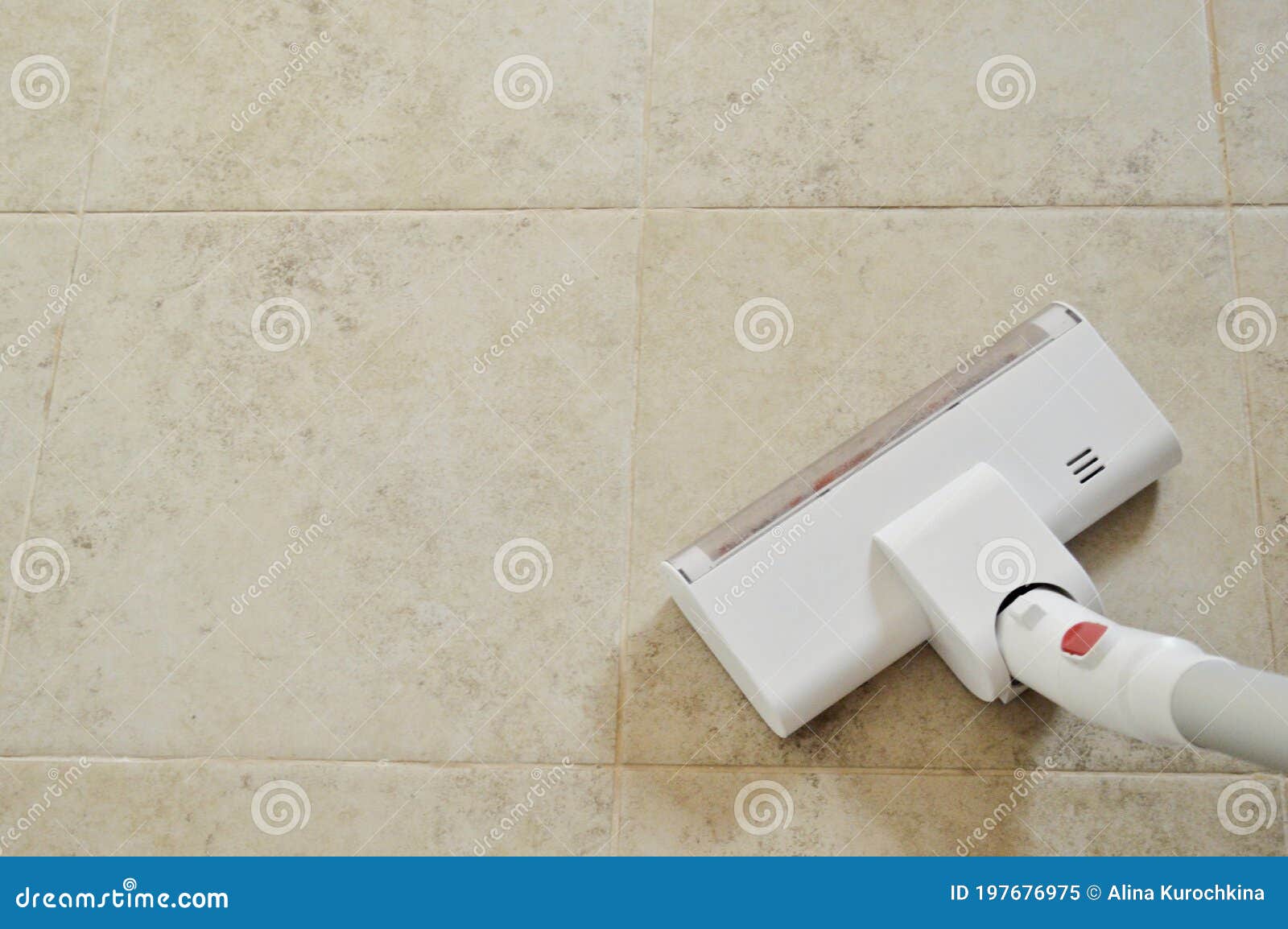 Vacuum Cleaner on the Floor. Vacuum Cleaner on Tile Background Stock