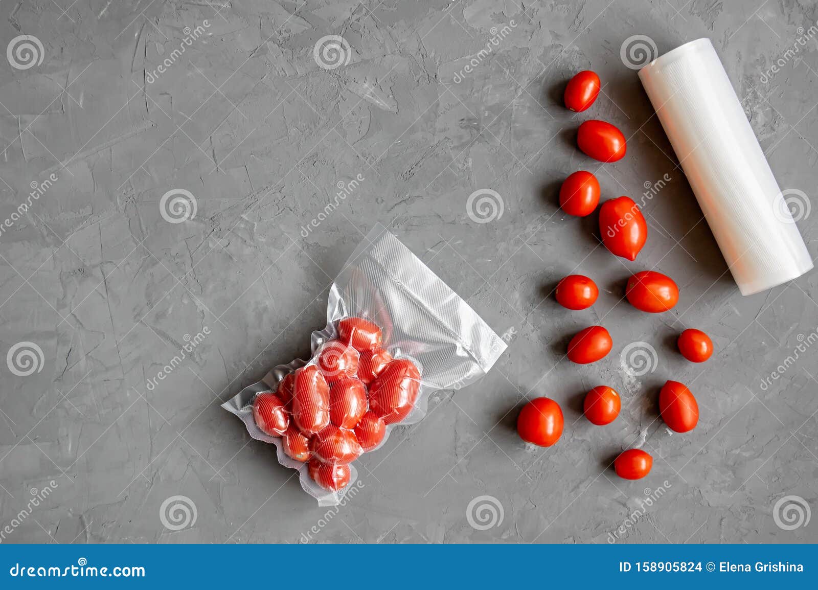 Vacuum Packaging of Fresh Tomatoes. Flat Lay. Copy Space Stock Photo