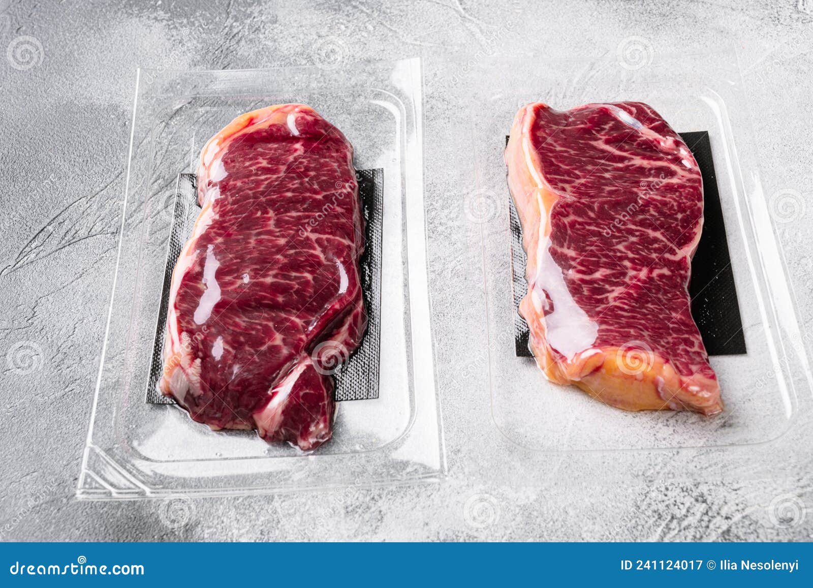 Vacuum Packed Beef, on Gray Stone Table Background, with Copy Space for
