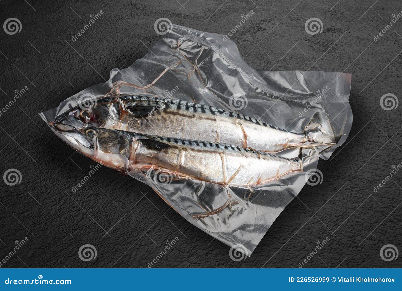 Vacuumpacked Fish, on Dark Stone Background, Mackerel. Semifinished
