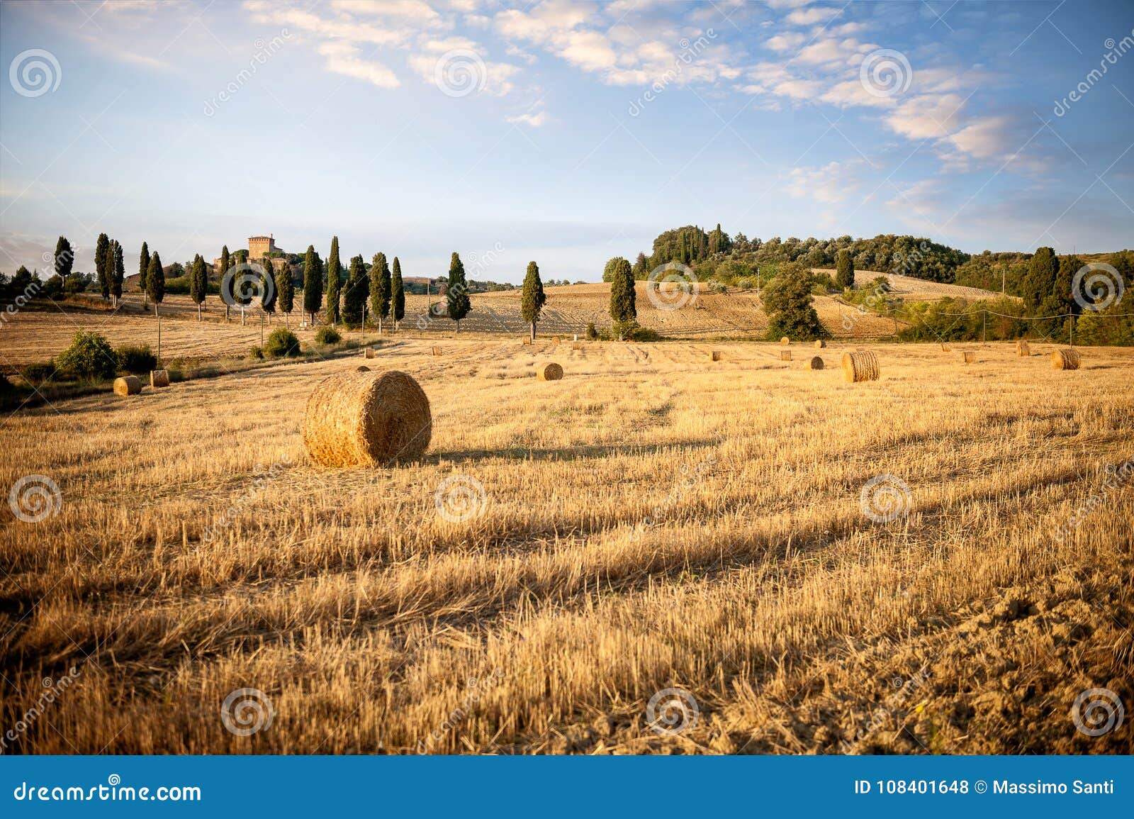 val d`orcia, tuscany. typical tuscan landscape with round bales after harvest. siena, italy
