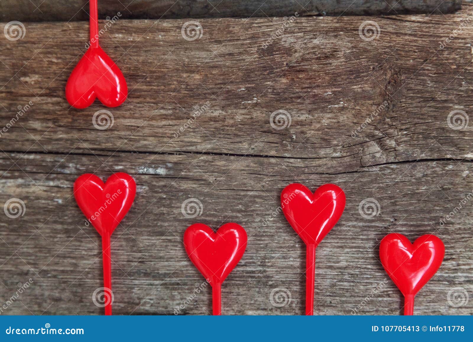 valentine background with hearts on rustic wood.
