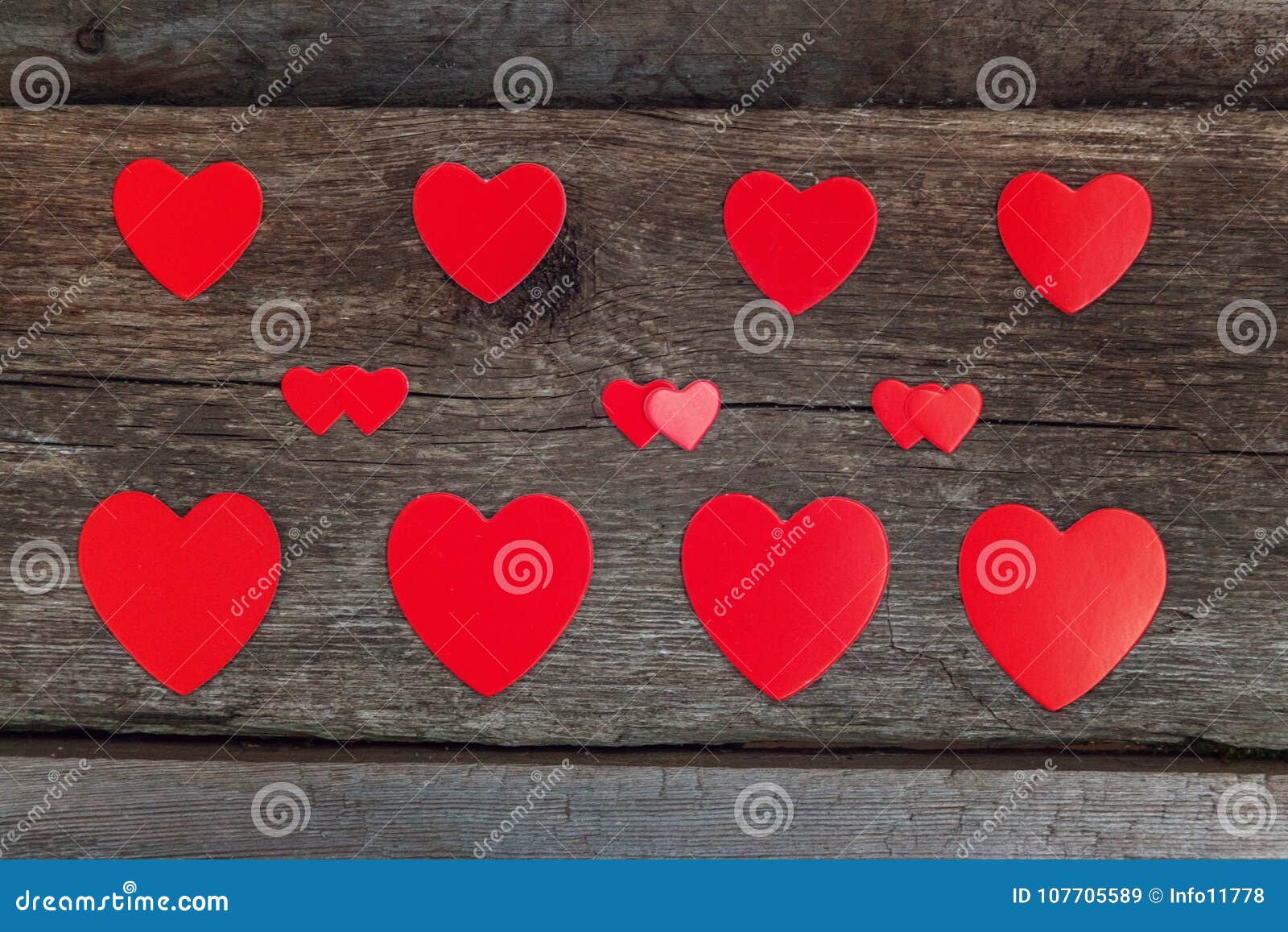 valentine background with hearts on rustic wood.