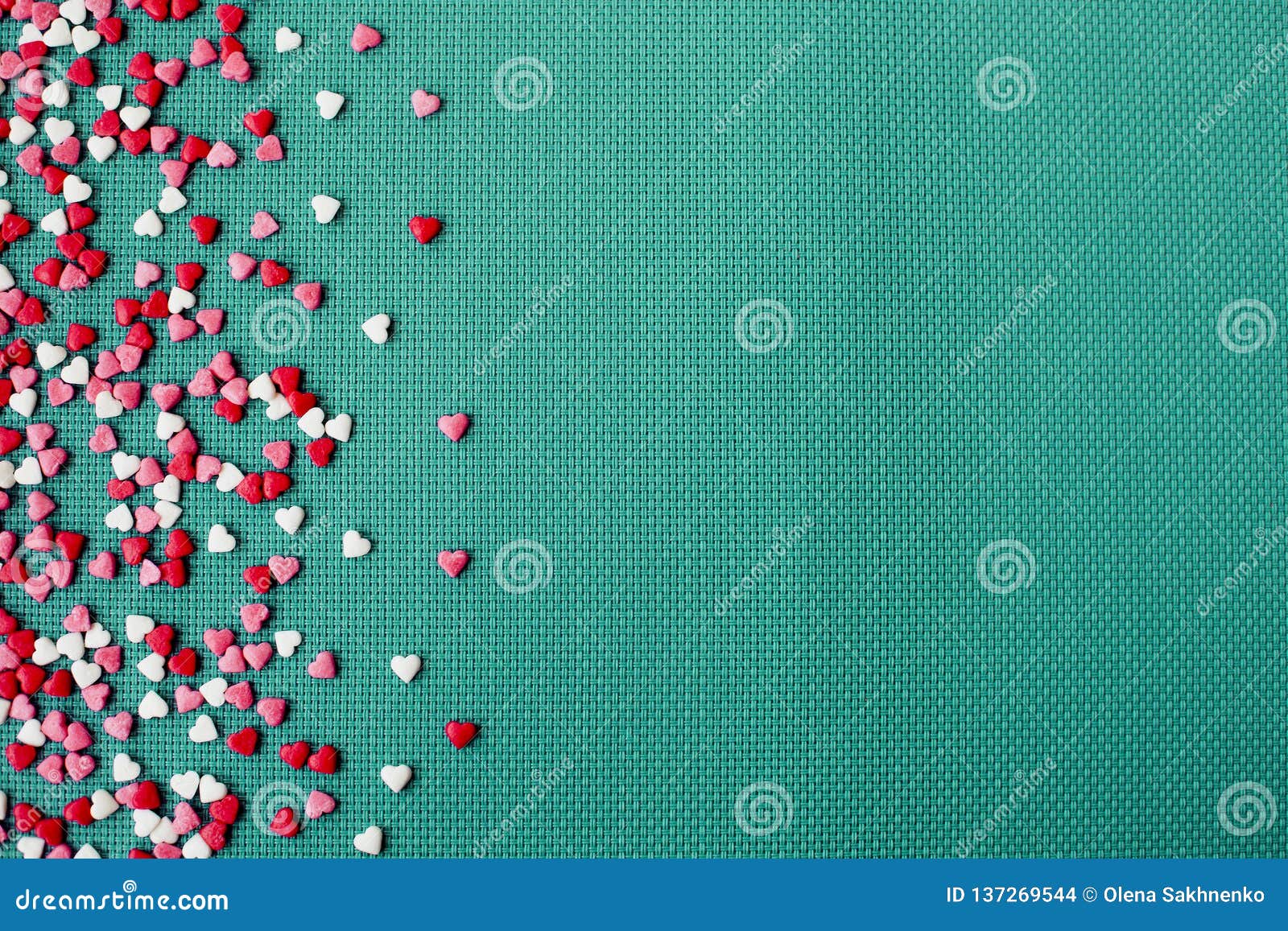 valentine day on greene background with red and white hearts, top view