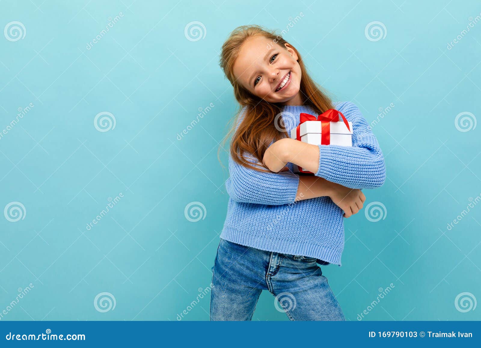 Valentine`s Day Concept. Little Girl Hugs a Gift on a Light Blue ...