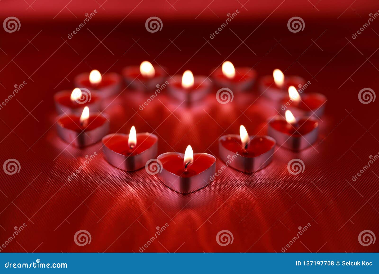valentine`s day, heart d candles on red background