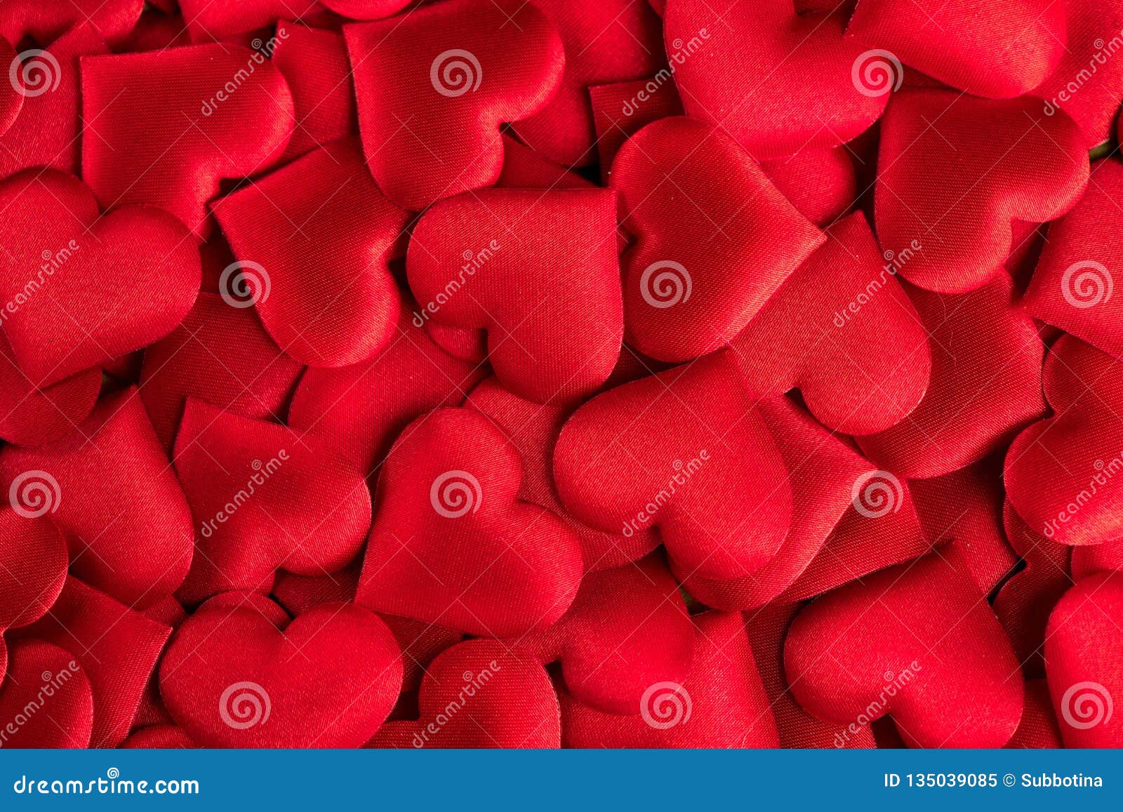 valentine`s day. red heart  backdrop. abstract holiday valentine background with red satin hearts. love