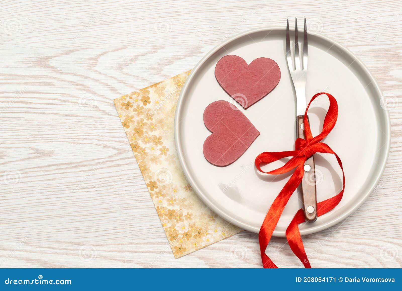 valentine`s day tabble serving with cutlery and napkin on white background. romantic dinner dating concept with copy space