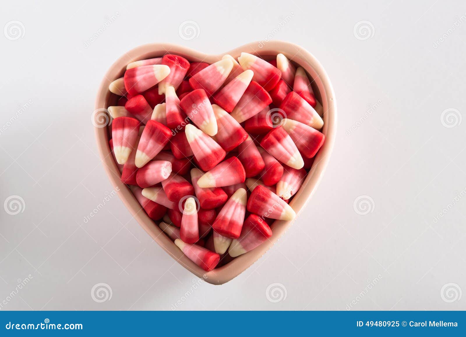 Valentines Day Candy Corn in Heart Shaped Bowl Horizontal Stock Image