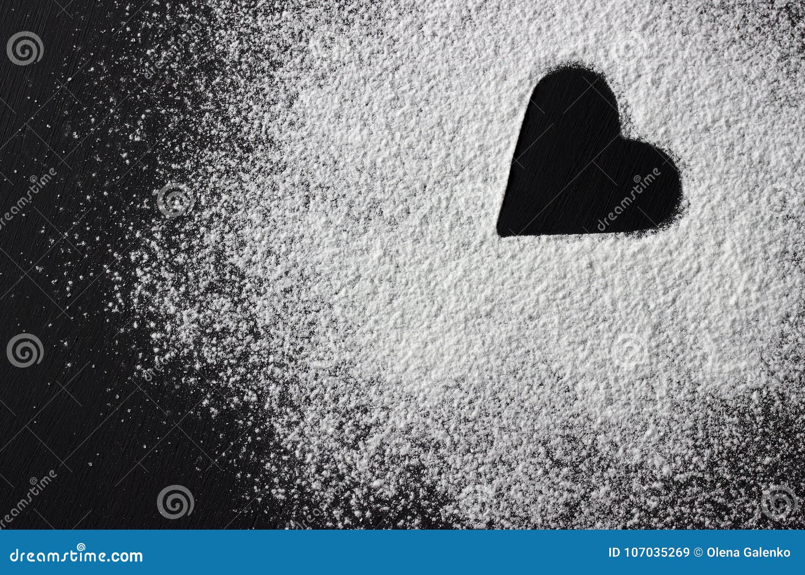 Valentines Day Concept White Flour Heart Shape on Black Backround
