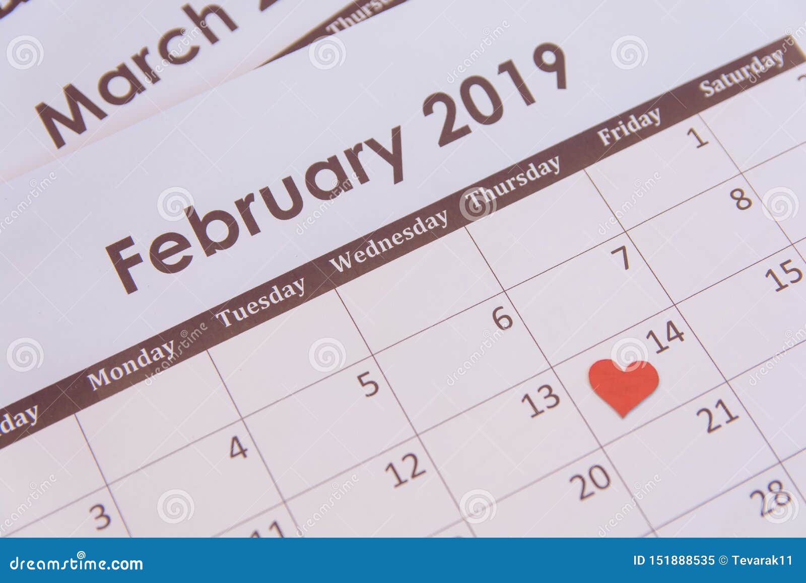 valentines day greeting card. red hearts paper on calendar page february 14 with copy space
