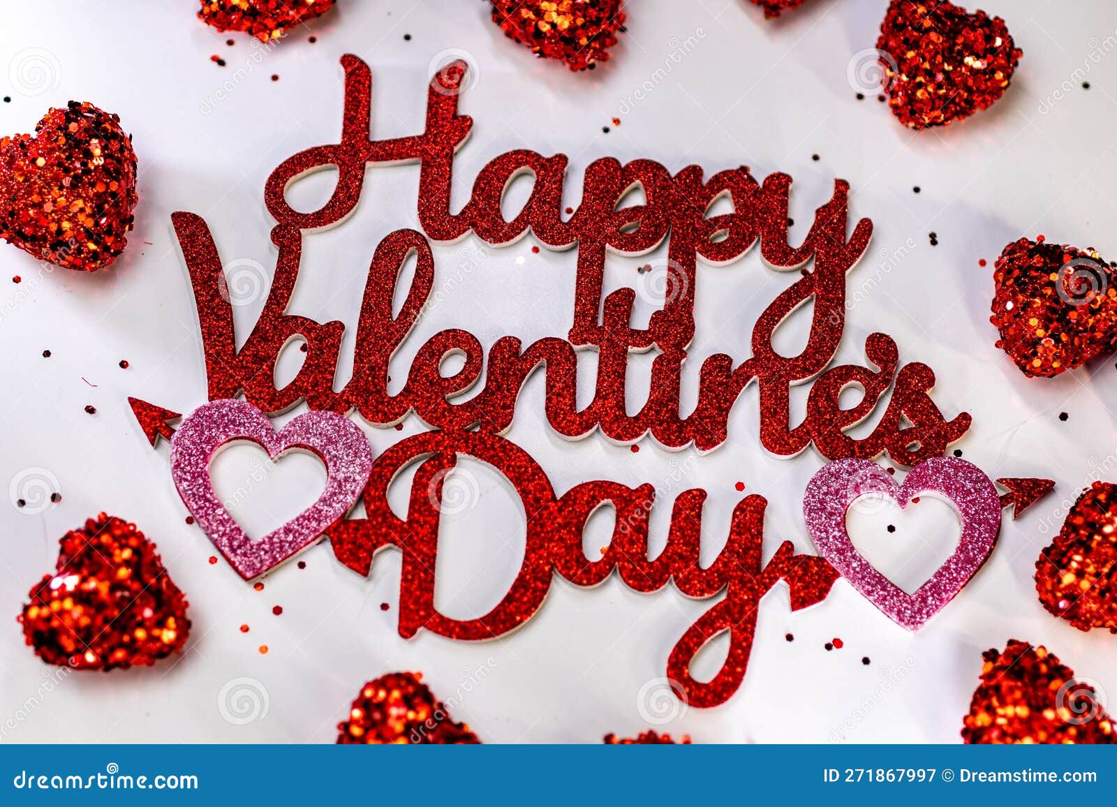valentines day image with the copy "happy valentines day" written on a sparkly background