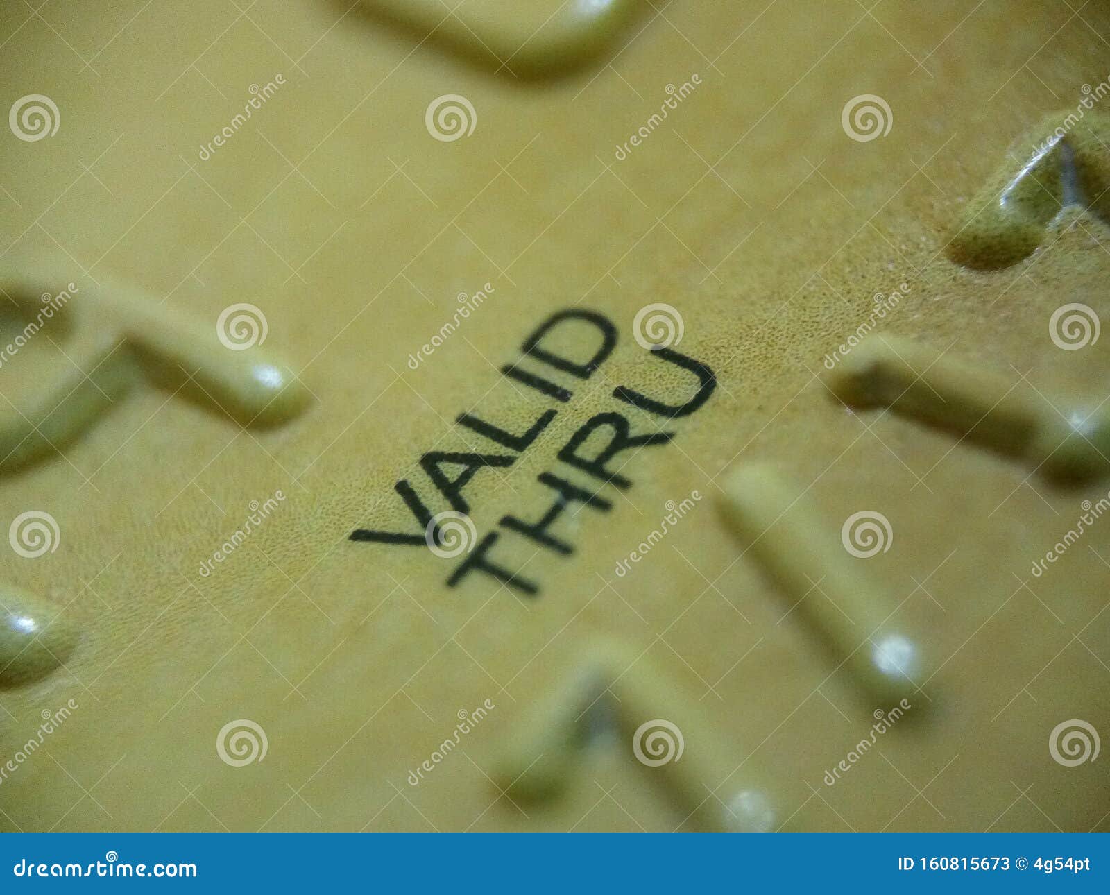 VALID THRU Written on a Surface with Parts of Embossed Numbers Stock Image Image of calendar