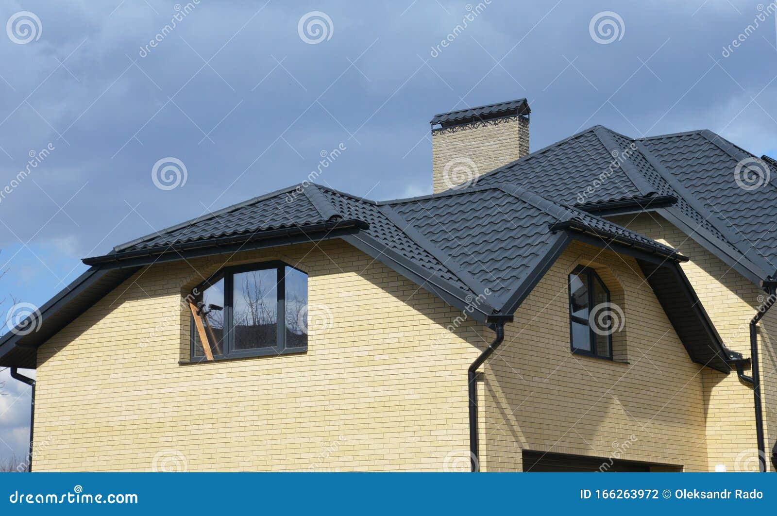Valley and Gable House Ceramic Tiled Roofing Construction with Gutter