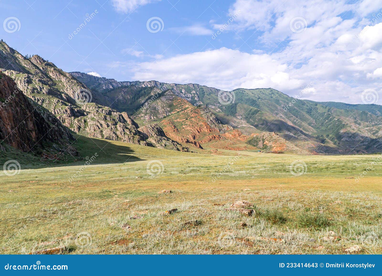 valley between the mountains covered with poor vegetation scorched by the scorching sun