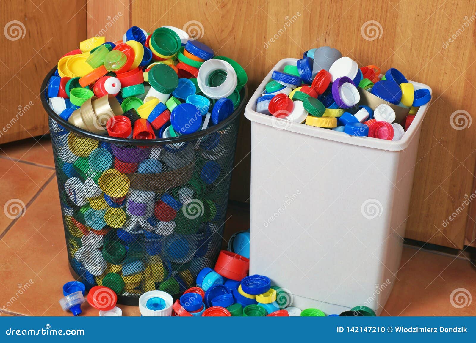 A Valuable Secondary Raw Material. Litter Bins Filled with Plastic Caps