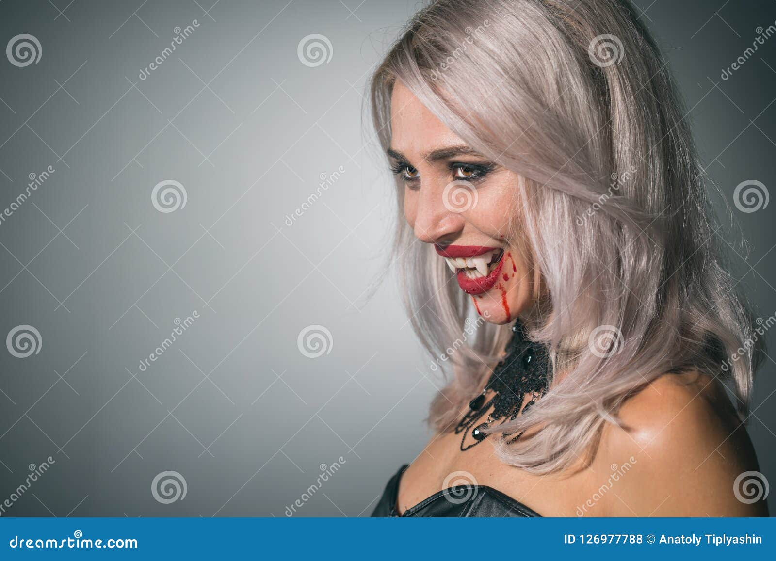 Vampire Woman with a Bloody Mouth and Teeth Fangs Celebrating a Stock ...