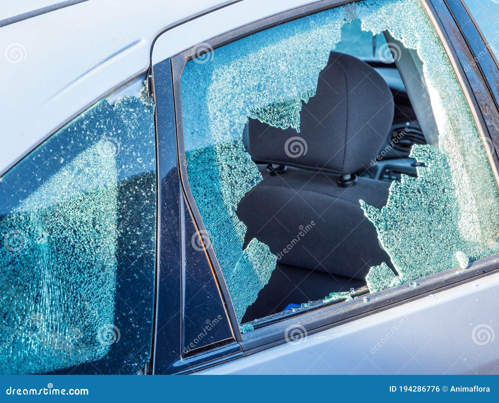 vandalism car window broken glass