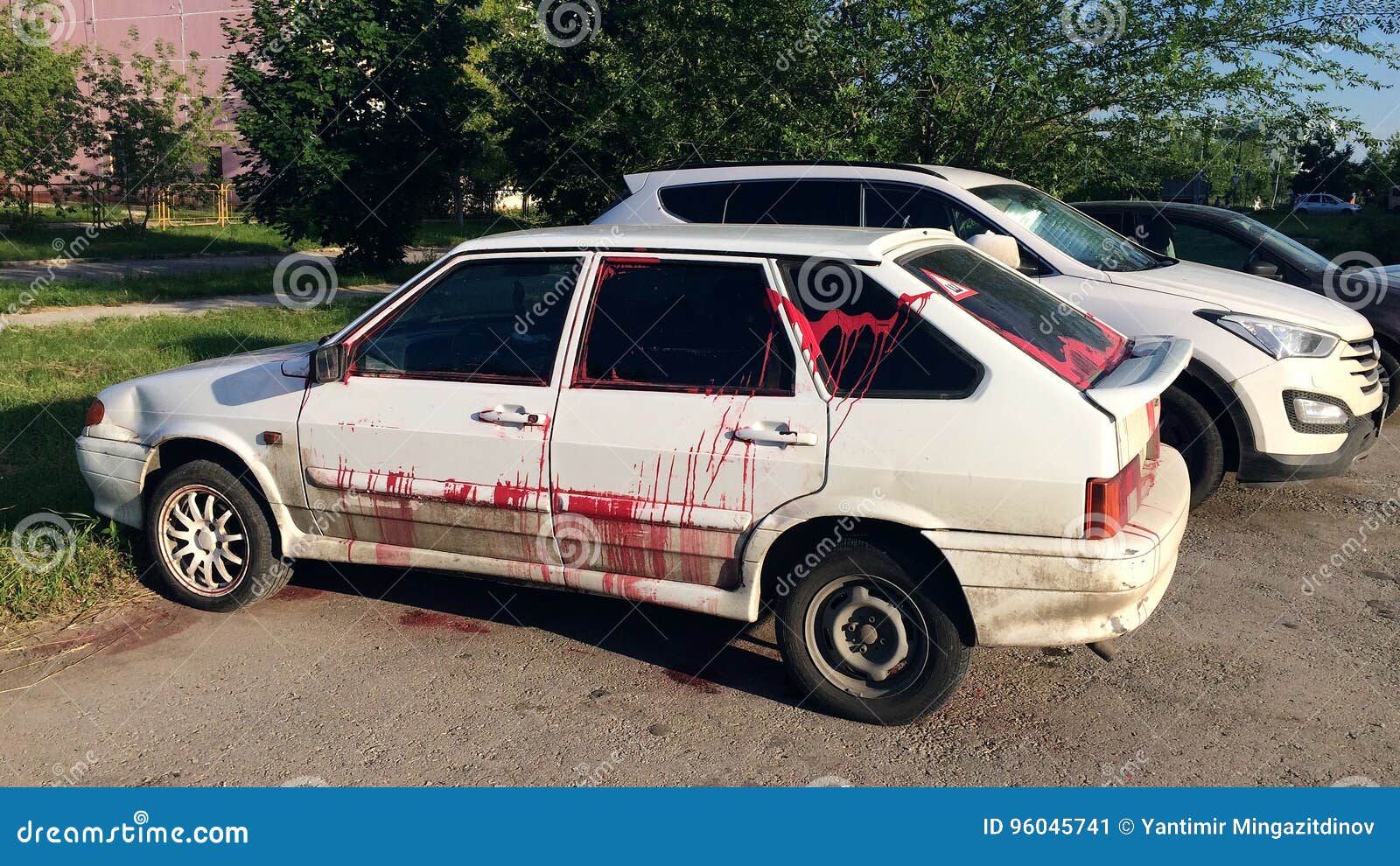 vandalism - a modern car, doused with paint in free parking