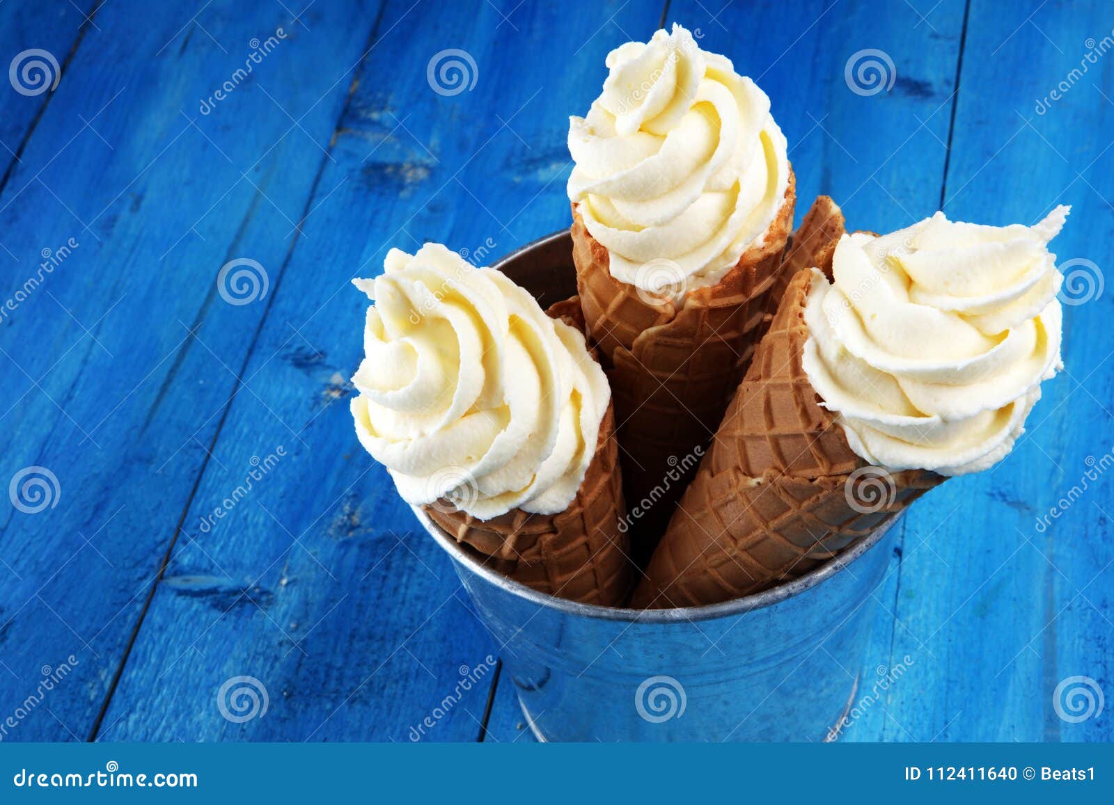 Vanilla Frozen Yogurt or Soft Ice Cream in Waffle Cone. Stock Photo
