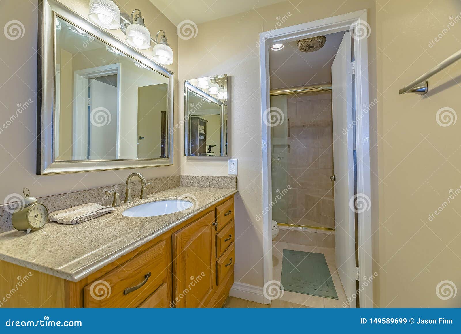 Vanity Unit With Brown Wooden Cabinets And Bright Lights Inside A Bathroom Stock Image Image Of Mirror Vanity Unit With Brown Wooden Cabinets And Bright Lights Inside A Bathroom Stock Image Image Of Mirror