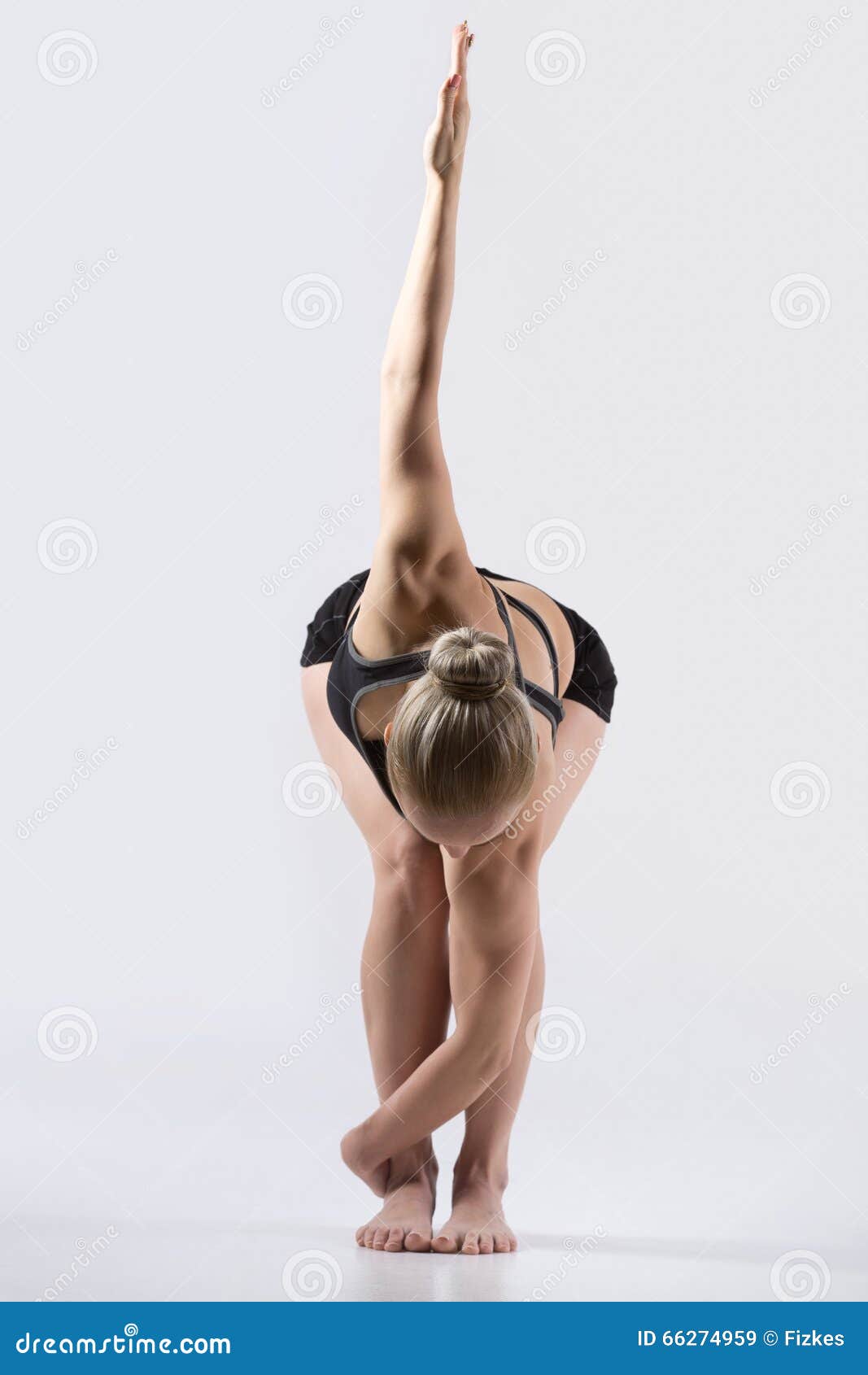 variation revolved chair pose sporty beautiful young woman practicing yoga doing parivrtta utkatasana working out wearing black 66274959