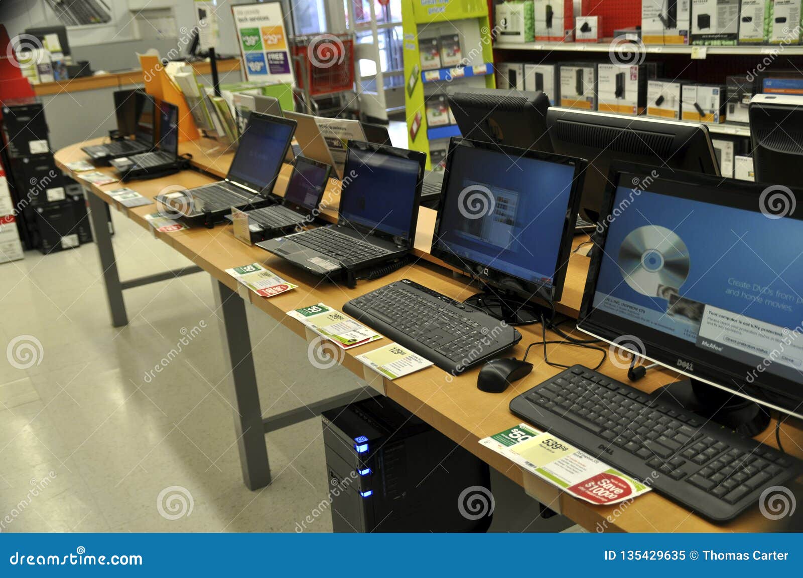 Computers for sale in a computer store. A variety of computers both laptop and desktops for sale in a computer store