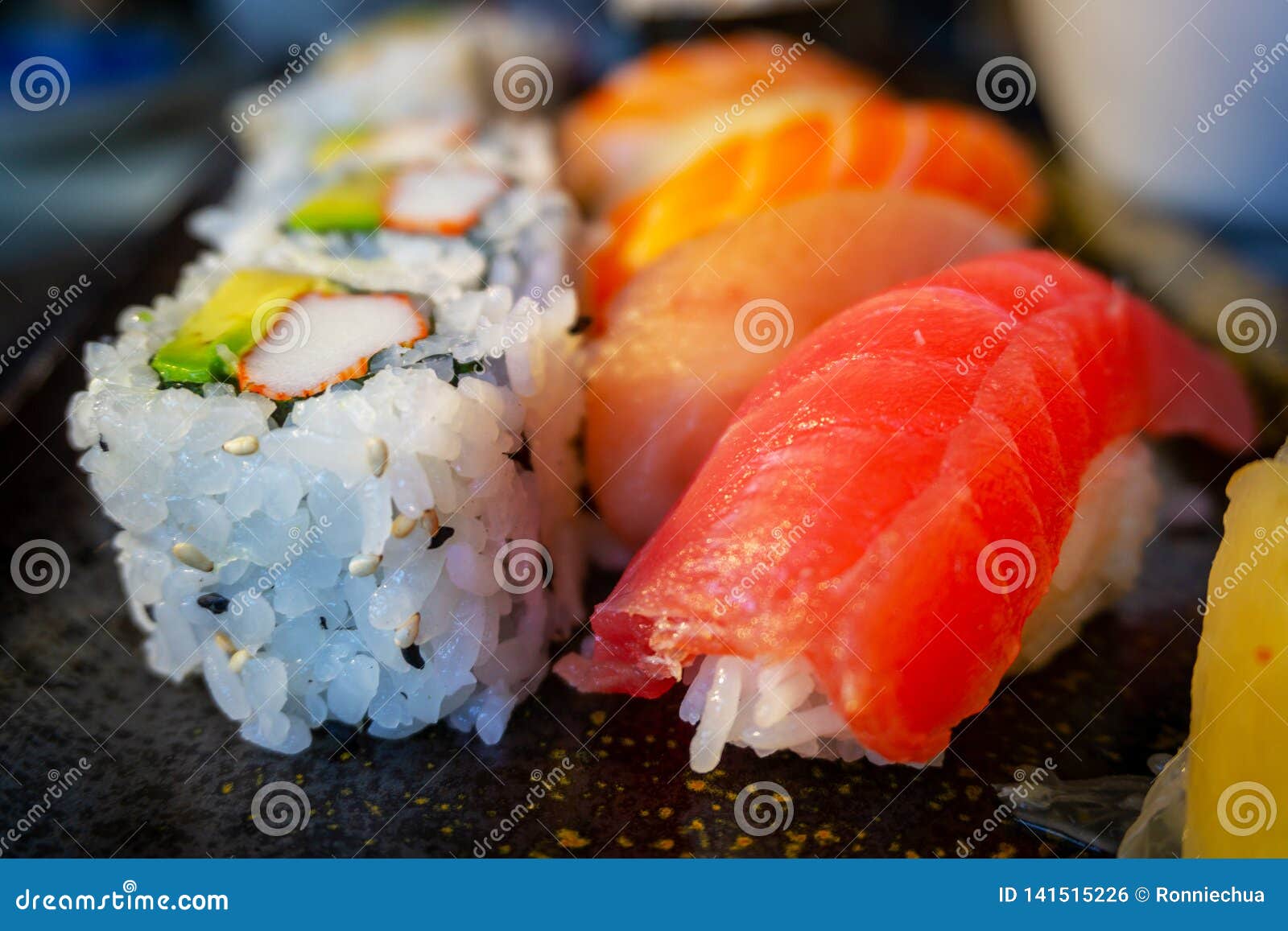 variety of delicious nigiri sushi bento with california roll