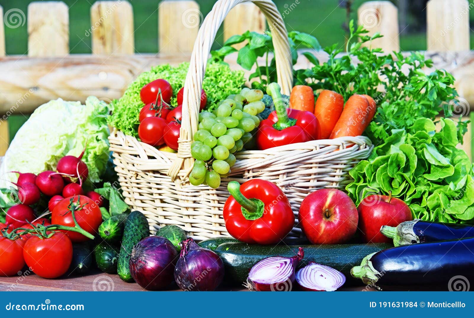Variety of Fresh Organic Vegetables in Wicker Basket Stock Photo