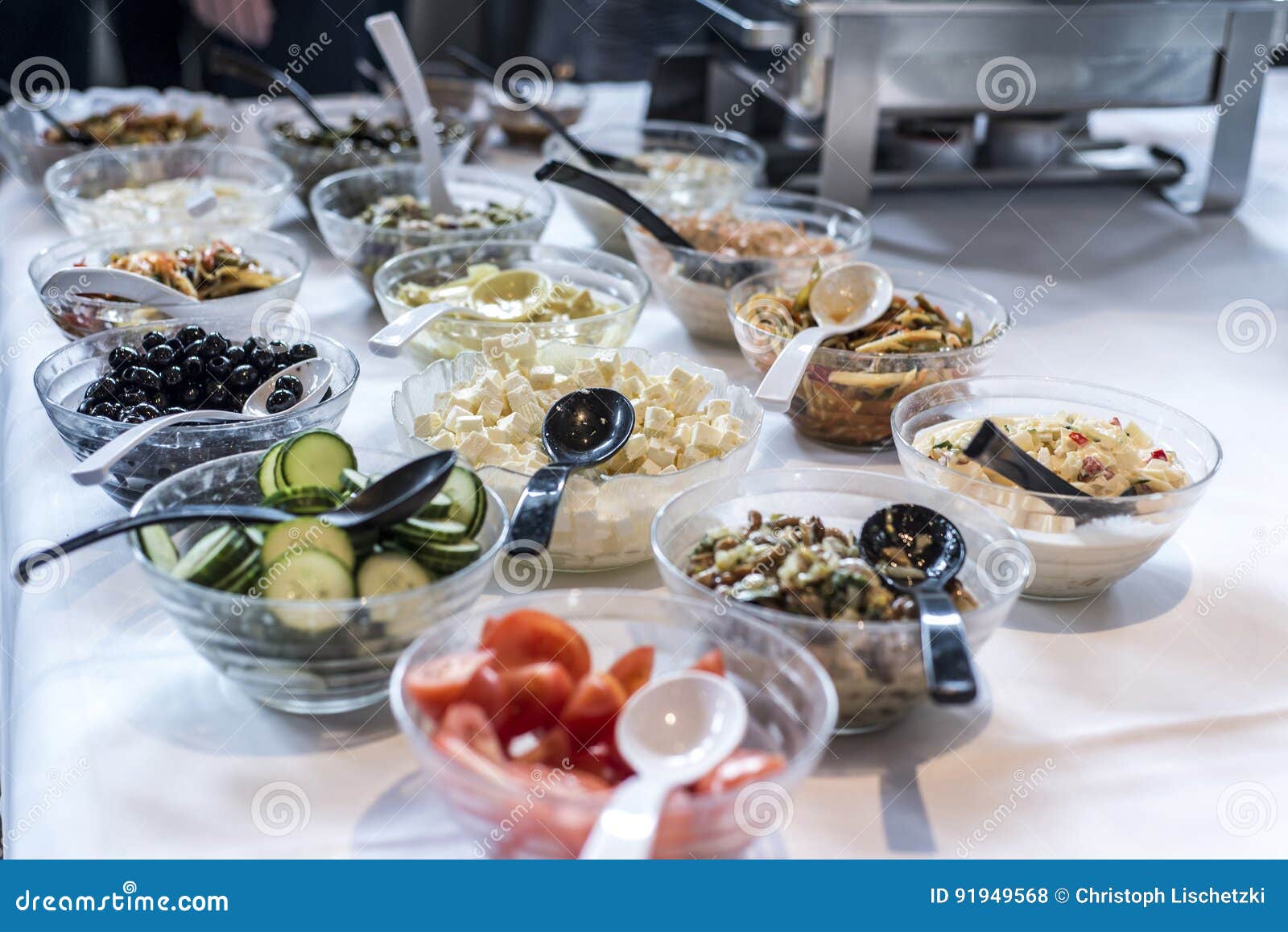 Variety of Fresh Salads Bowls on Buffet Table Business Dinner Stock