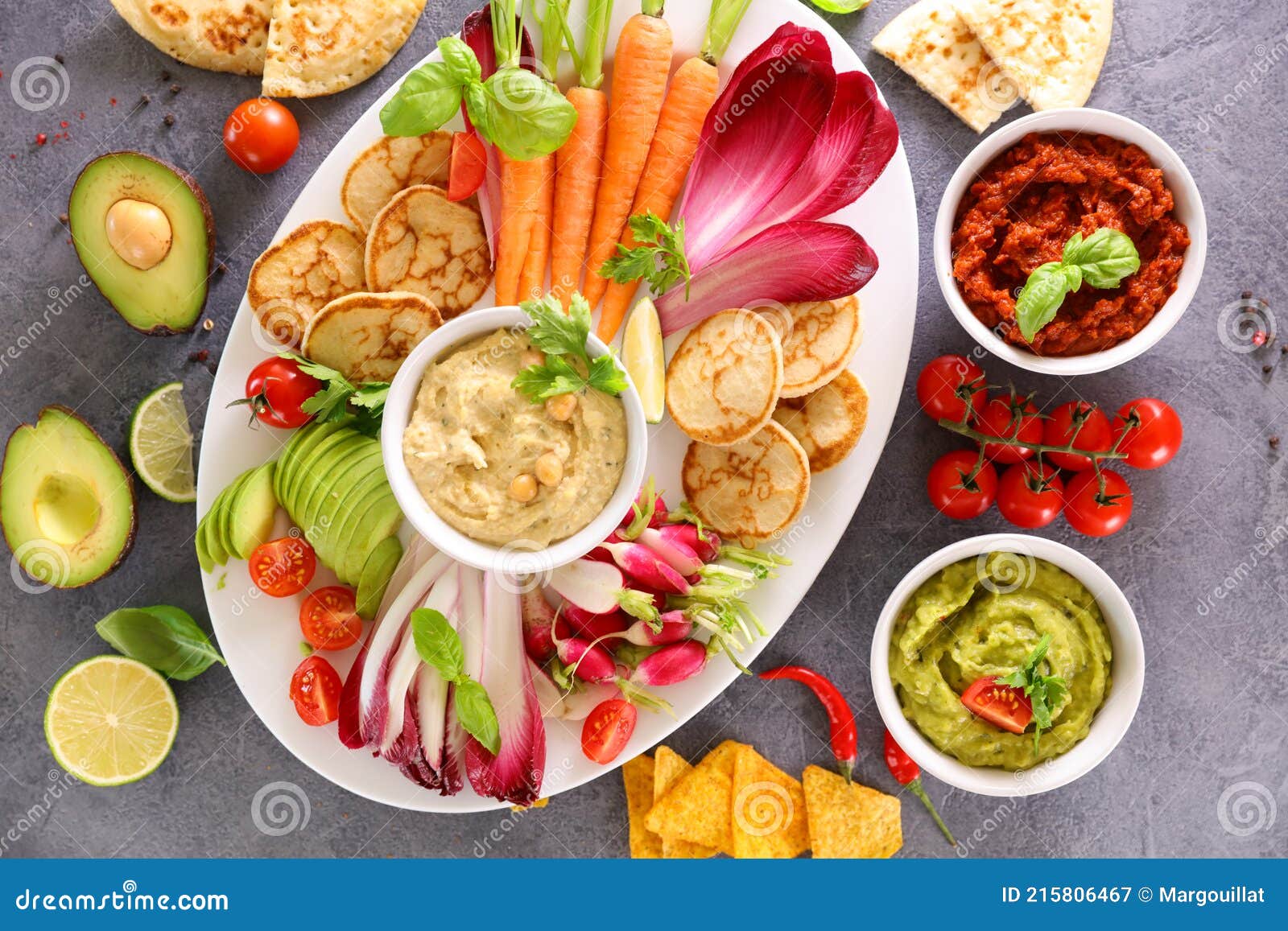 Fresh vegetable and dips stock image. Image of avocado 215806467