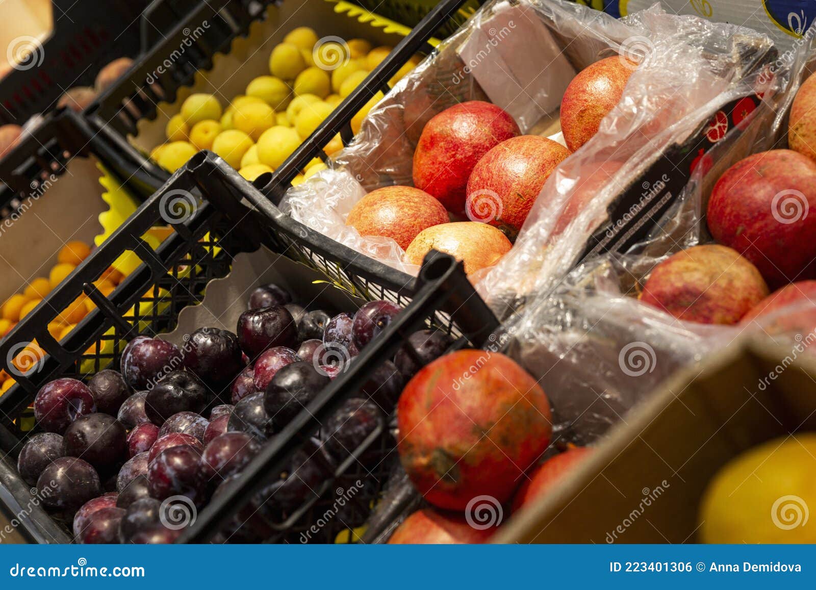A Variety of Fruits in Plastic Containers in the Store. Side View Stock