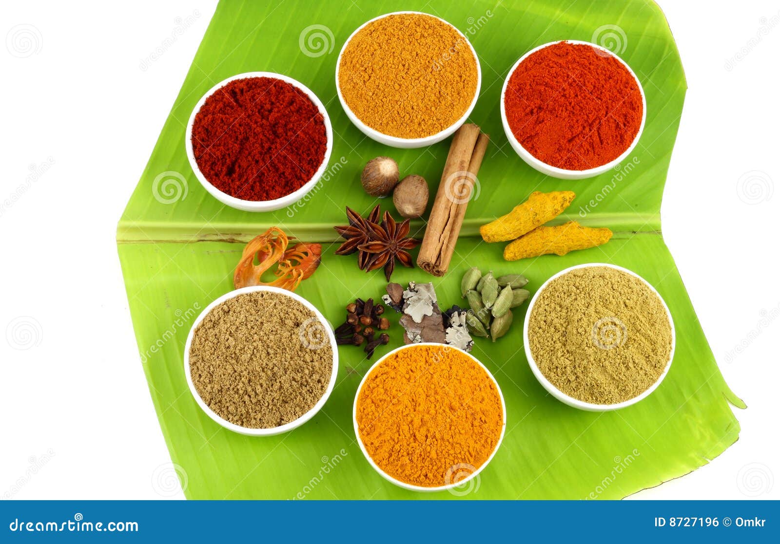variety of spices on banana leaves