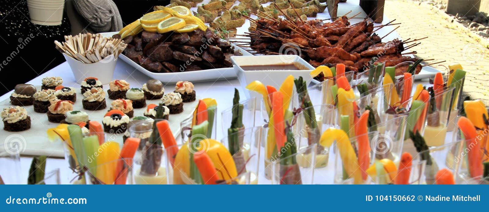 Variety of Tasty Hors D`oeuvres on a Buffet Table for a Reception Stock