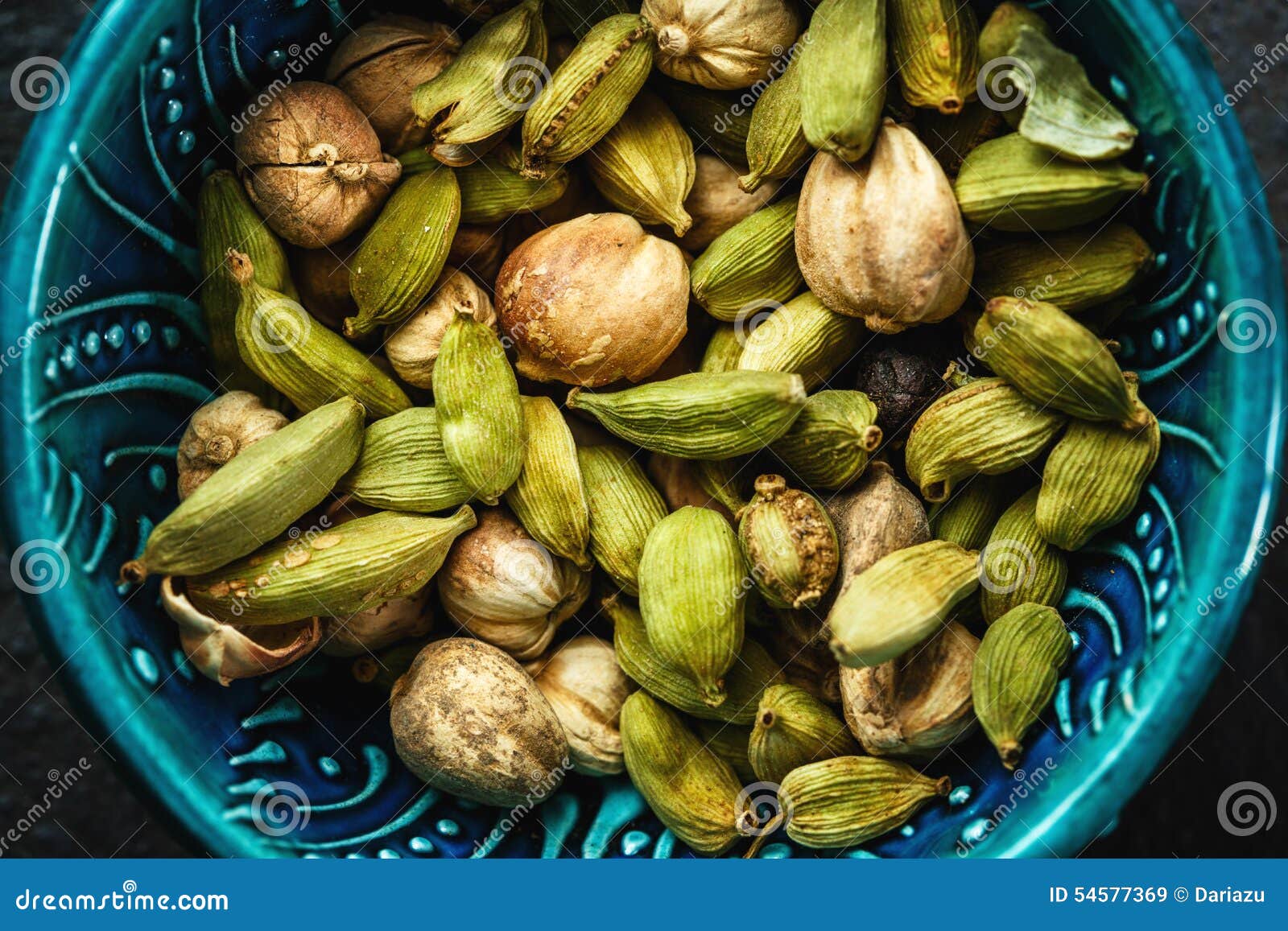 various cardamom spices in authentic turkish bowl