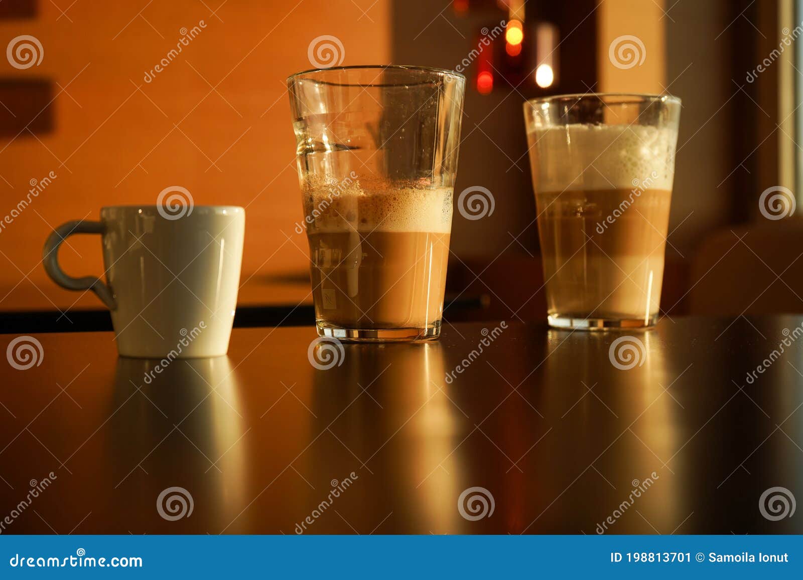 various coffee-based drinks photographed in the sunset light