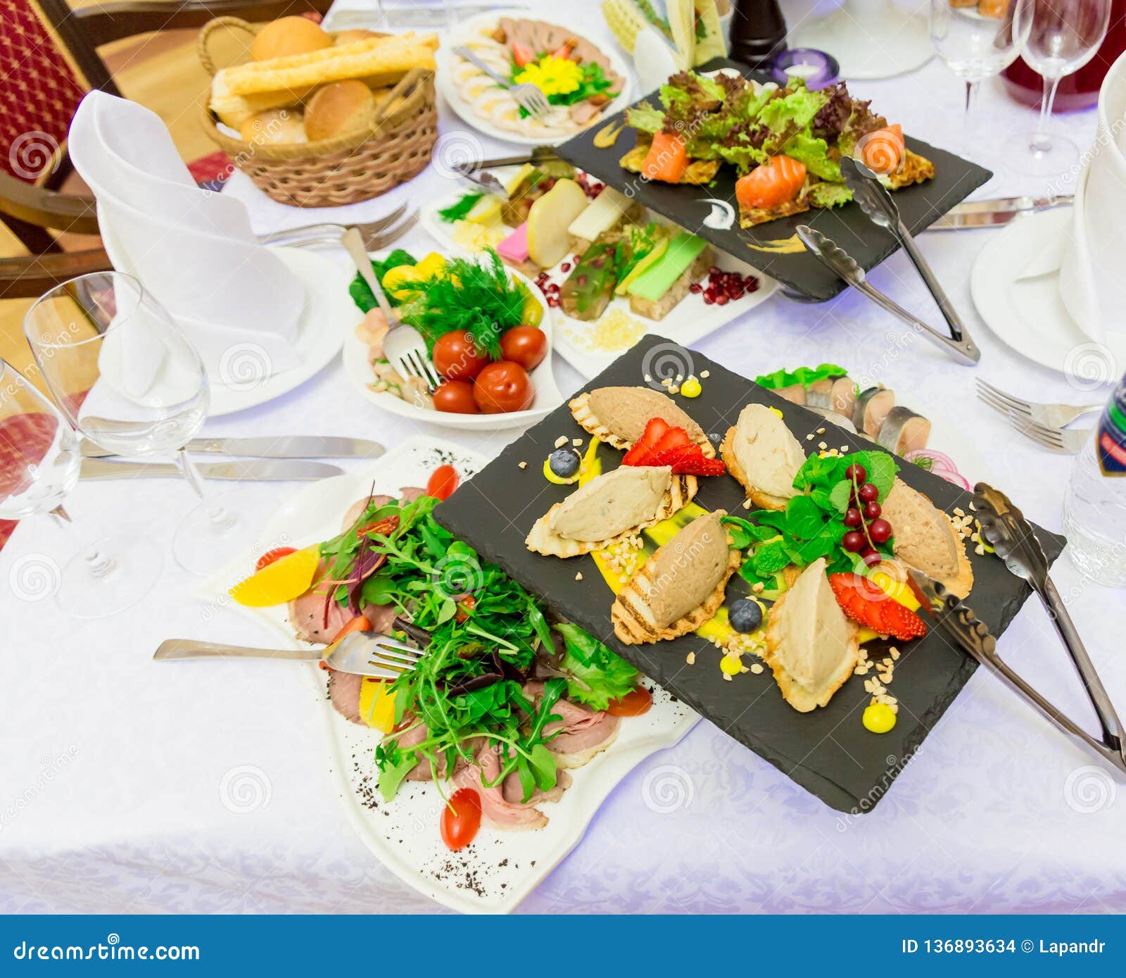 Various Cold Appetizers on the Buffet Seafood, Vegetables, Meat